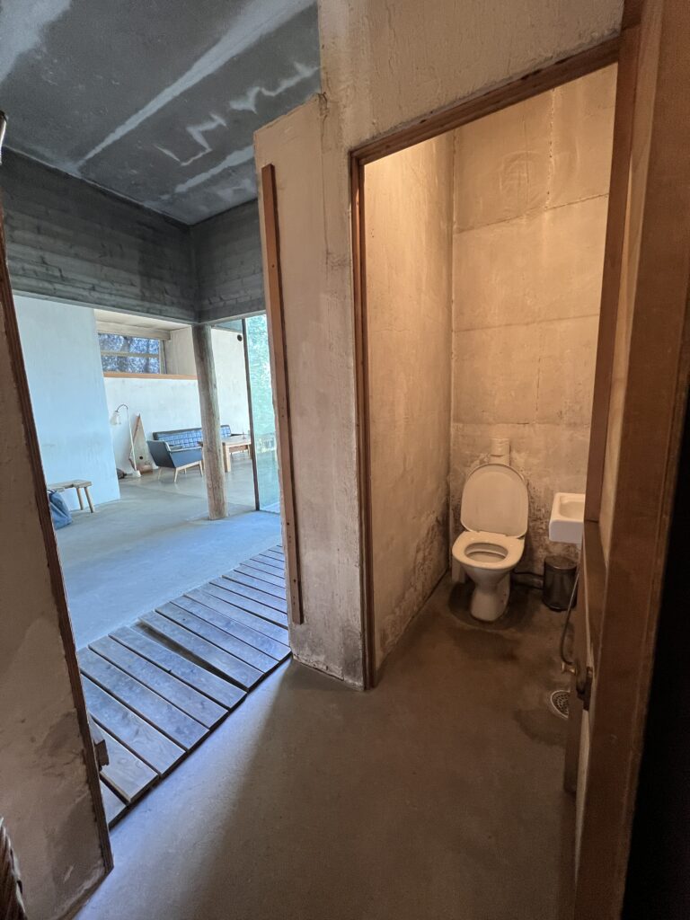 View from dressing room to lobby, with toilet on the right.